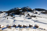 Luxury ski-in/ski-out homes nestled in the snowy mountains.