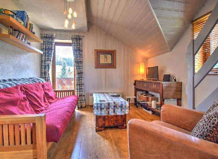 Cozy mountain chalet with a comfortable sofa bed, perfect for a relaxing getaway.