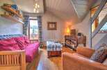 Cozy mountain chalet with a comfortable sofa bed, perfect for a relaxing getaway.