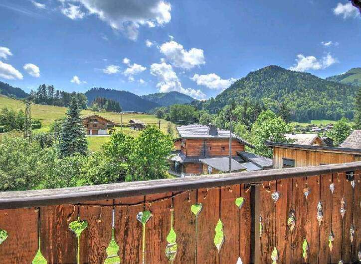 Mountain view chalet with balcony.