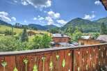 Mountain view chalet with balcony.