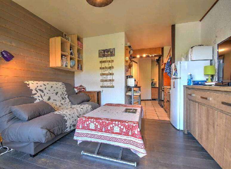 Cozy studio apartment featuring a comfortable sofa bed, perfect for a relaxing getaway.
