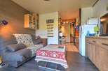 Cozy studio apartment featuring a comfortable sofa bed, perfect for a relaxing getaway.