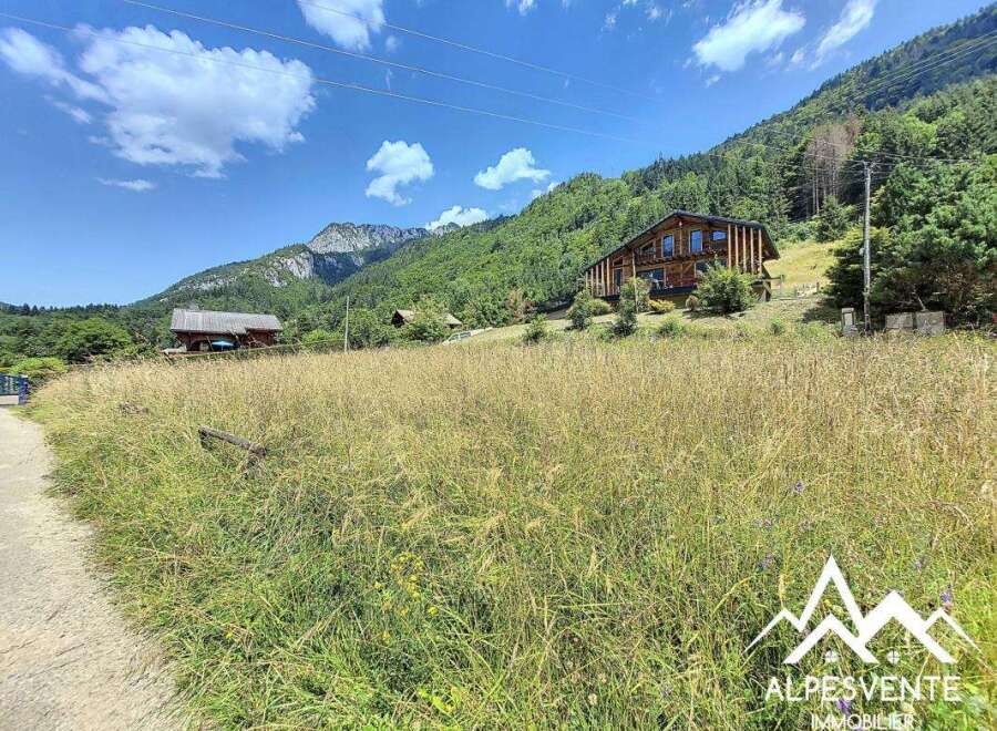 Mountain chalet with stunning views, spacious layout, and large windows.