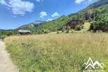 Mountain chalet with stunning views, spacious layout, and large windows.