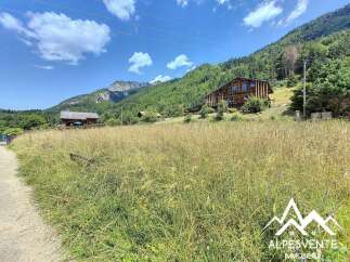 Mountain chalet with stunning views, spacious layout, and large windows.