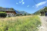 Mountain view property with large grassy area.