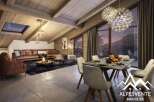 This stunning chalet boasts a spacious open-plan living area with a cozy fireplace, perfect for relaxing after a day on the slopes.