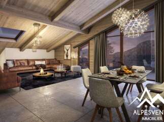 This stunning chalet boasts a spacious open-plan living area with a cozy fireplace, perfect for relaxing after a day on the slopes.