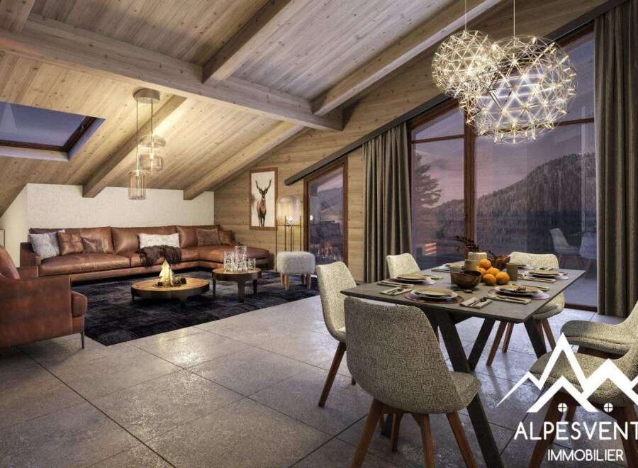 This stunning chalet boasts a spacious open-plan living area with a cozy fireplace, perfect for relaxing after a day on the slopes.