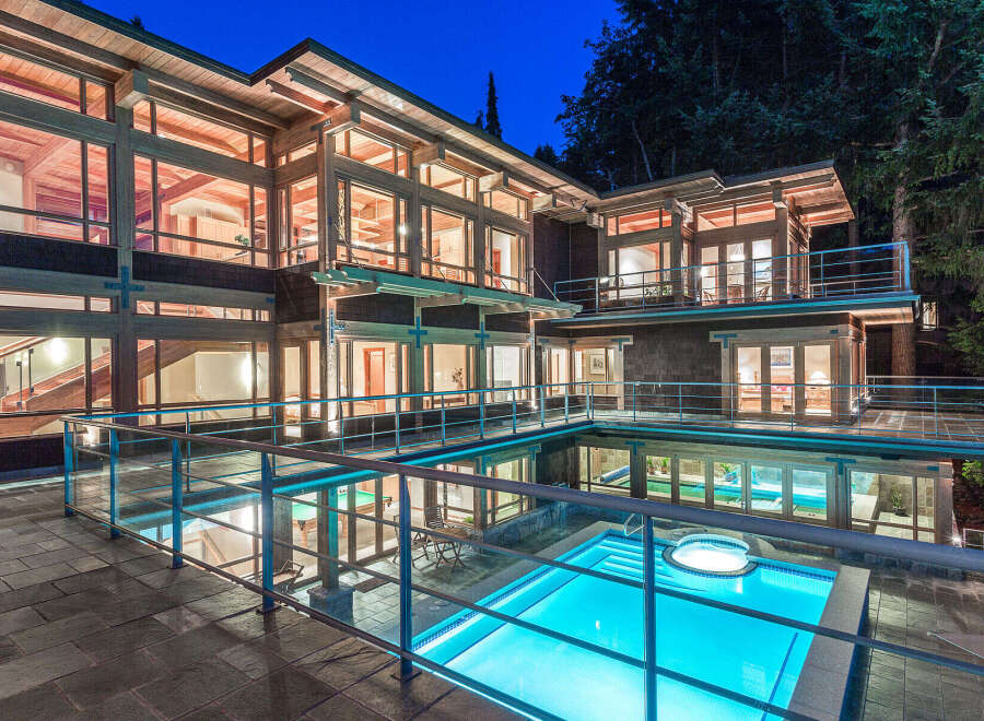 This stunning multi-level home boasts an indoor pool and hot tub, perfect for relaxation and entertainment.