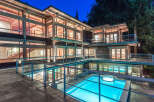 This stunning multi-level home boasts an indoor pool and hot tub, perfect for relaxation and entertainment.