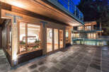 This stunning property boasts a luxurious master bedroom with large windows offering breathtaking views, a spacious patio perfect for outdoor entertaining, and a modern design that seamlessly blends indoor and outdoor living.