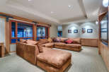This luxurious family room boasts a spacious sectional sofa, perfect for movie nights and family gatherings.