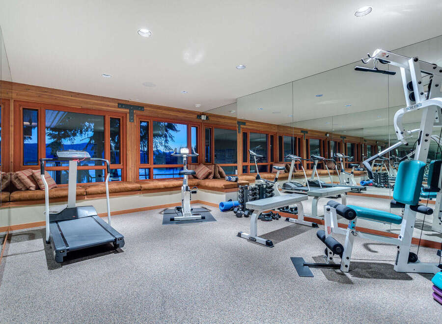 This stunning home boasts a luxurious, fully-equipped gym with state-of-the-art equipment, perfect for a serious workout.
