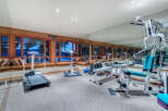 This stunning home boasts a luxurious, fully-equipped gym with state-of-the-art equipment, perfect for a serious workout.