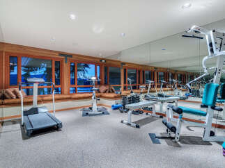 This stunning home boasts a luxurious, fully-equipped gym with state-of-the-art equipment, perfect for a serious workout.