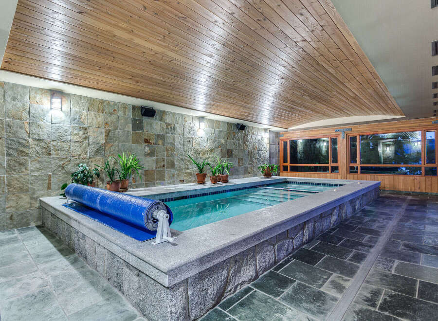This luxurious indoor pool is perfect for a relaxing swim any time of year.