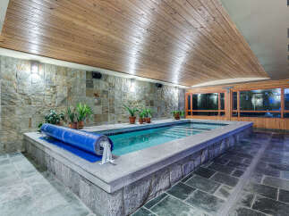 This luxurious indoor pool is perfect for a relaxing swim any time of year.