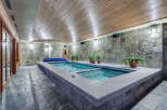 Indulge in this luxurious indoor lap pool, featuring a sleek design and tranquil ambiance.