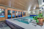 Indulge in the ultimate relaxation experience with this stunning indoor pool and hot tub.