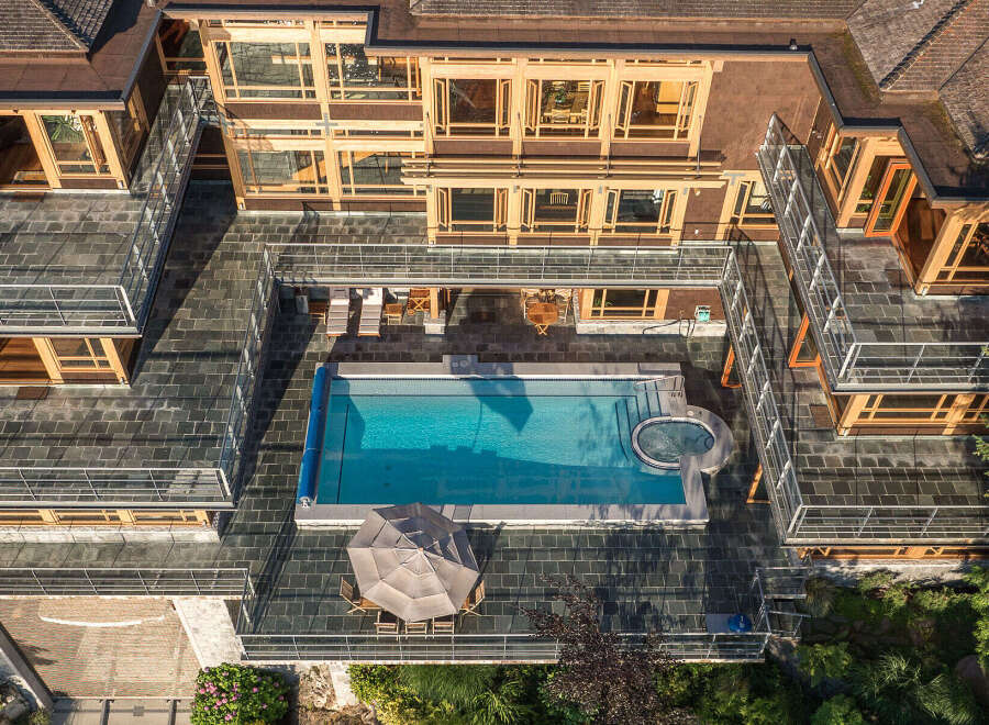 This stunning property boasts a multi-level design with expansive outdoor living spaces.