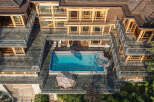 This stunning property boasts a multi-level design with expansive outdoor living spaces.