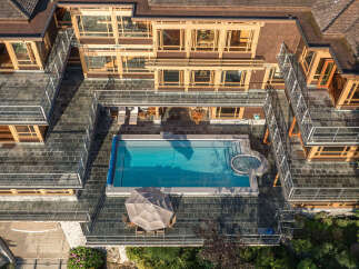 This stunning property boasts a multi-level design with expansive outdoor living spaces.