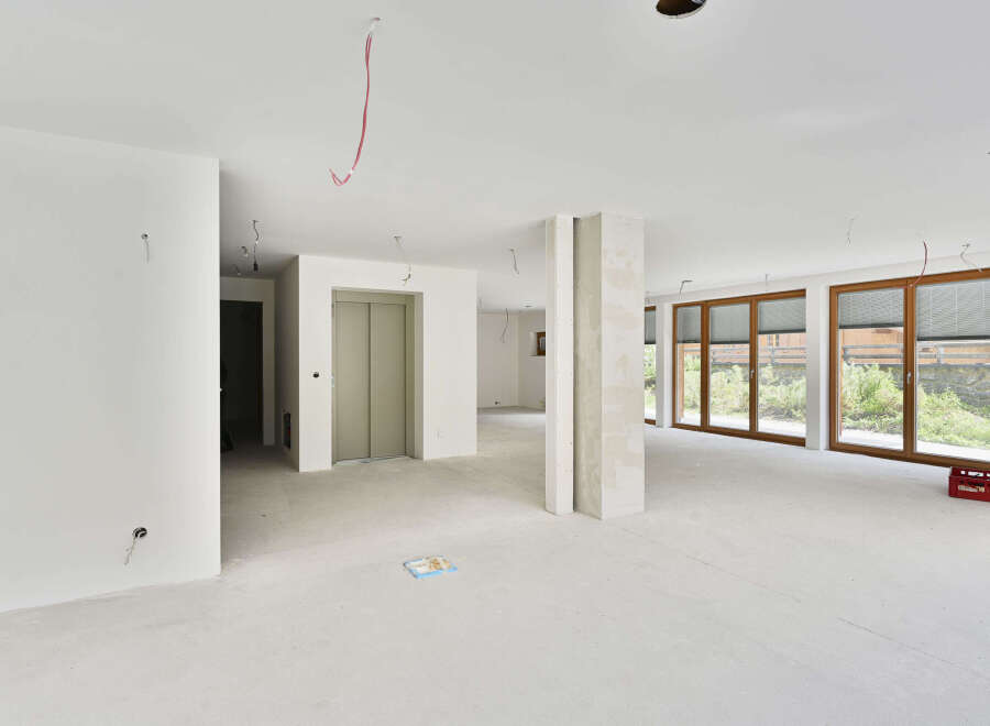 This stunning property boasts an open-plan living area with floor-to-ceiling windows, offering breathtaking views and ample natural light.