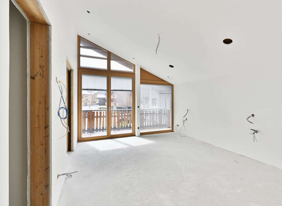 This stunning property boasts a spacious, open-plan design with large windows that flood the room with natural light.