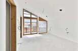 This stunning property boasts a spacious, open-plan design with large windows that flood the room with natural light.