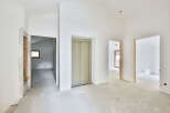 This stunning property boasts an open-concept design with high ceilings and sleek elevator access.