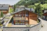 This stunning chalet boasts a prime location in the Austrian Alps, offering breathtaking mountain views.