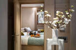 This charming chalet bedroom features twin beds with plush bedding, creating a cozy and inviting atmosphere.