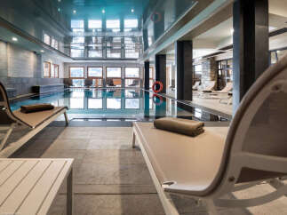 Relax and unwind in our luxurious indoor pool area, complete with comfortable loungers and a tranquil atmosphere.