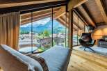 Wake up to breathtaking mountain views from this luxurious chalet.