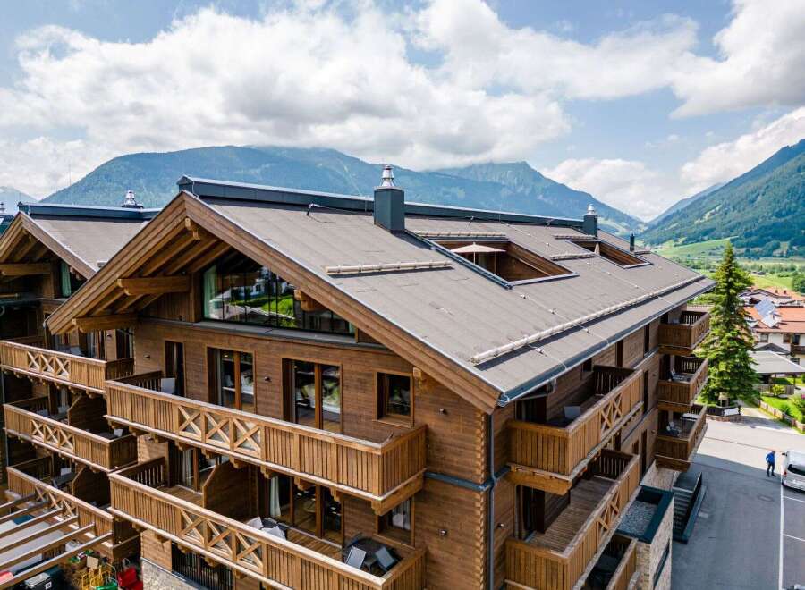 This stunning chalet boasts multiple levels of luxurious accommodations, each with its own private balcony offering breathtaking mountain views.