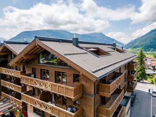 This stunning chalet boasts multiple levels of luxurious accommodations, each with its own private balcony offering breathtaking mountain views.