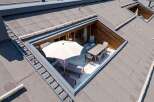 This stunning property boasts a unique rooftop terrace, accessible via a convenient ladder, perfect for outdoor entertaining.