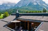 This stunning property boasts a unique rooftop terrace offering breathtaking mountain views.