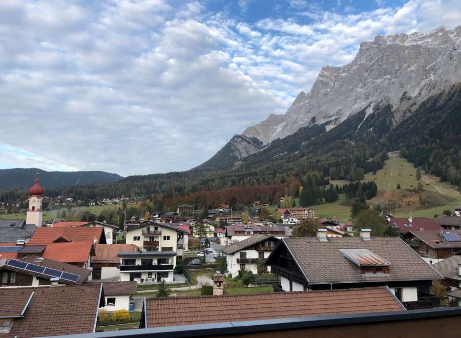 Nestled in a charming village, this property offers breathtaking views of majestic mountains and lush greenery.