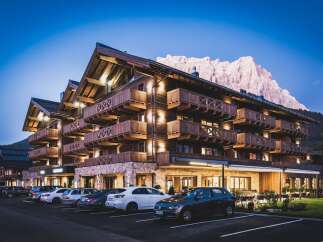 Nestled in the Dolomites, this stunning hotel boasts a unique blend of modern luxury and traditional alpine architecture.
