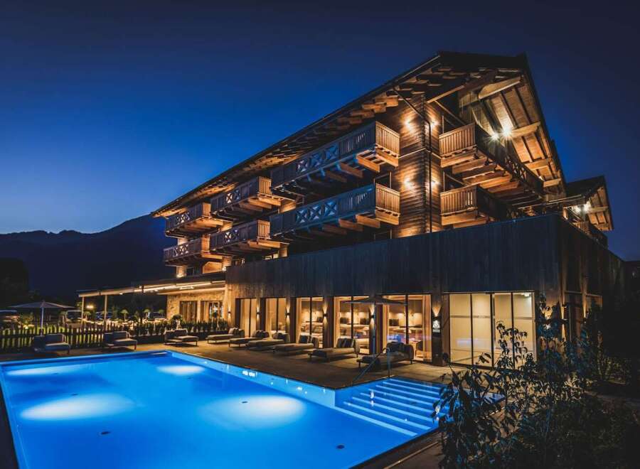 Nestled in the mountains, this stunning hotel boasts a modern design with traditional alpine accents.