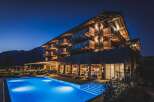 Nestled in the mountains, this stunning hotel boasts a modern design with traditional alpine accents.