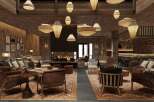 This stunning hotel lobby boasts a rustic-chic design with a cozy fireplace as its centerpiece.