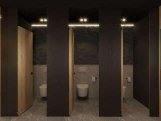 Modern restroom design with sleek dark gray partitions, wood-paneled doors, and stylish geometric artwork.