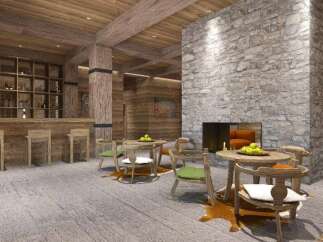 This stunning lodge boasts a rustic-chic design, featuring a cozy stone fireplace as the centerpiece of the main living area.