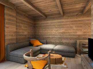 Cozy mountain chalet living room with wood-paneled walls and ceiling, featuring a comfortable gray sectional sofa and a rustic wooden coffee table.