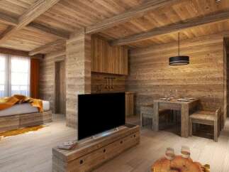 This stunning chalet boasts a cozy living space with exposed wooden beams, a flat-screen TV, and a rustic dining area.