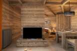 This stunning chalet boasts a spacious open-plan living area with a cozy wooden interior, perfect for relaxing after a day on the slopes.